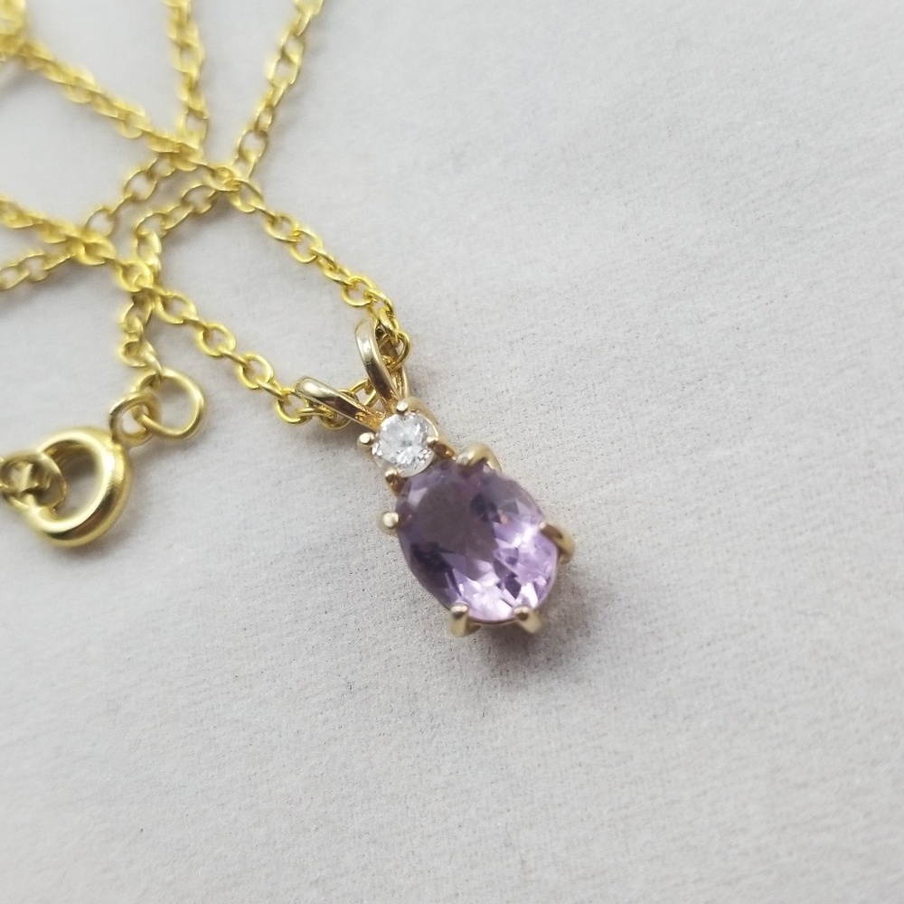 Purple amethyst necklace on gold colored chain